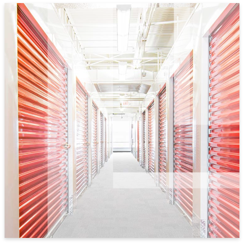 Leon logo overlay on self storage building with rolling doors.